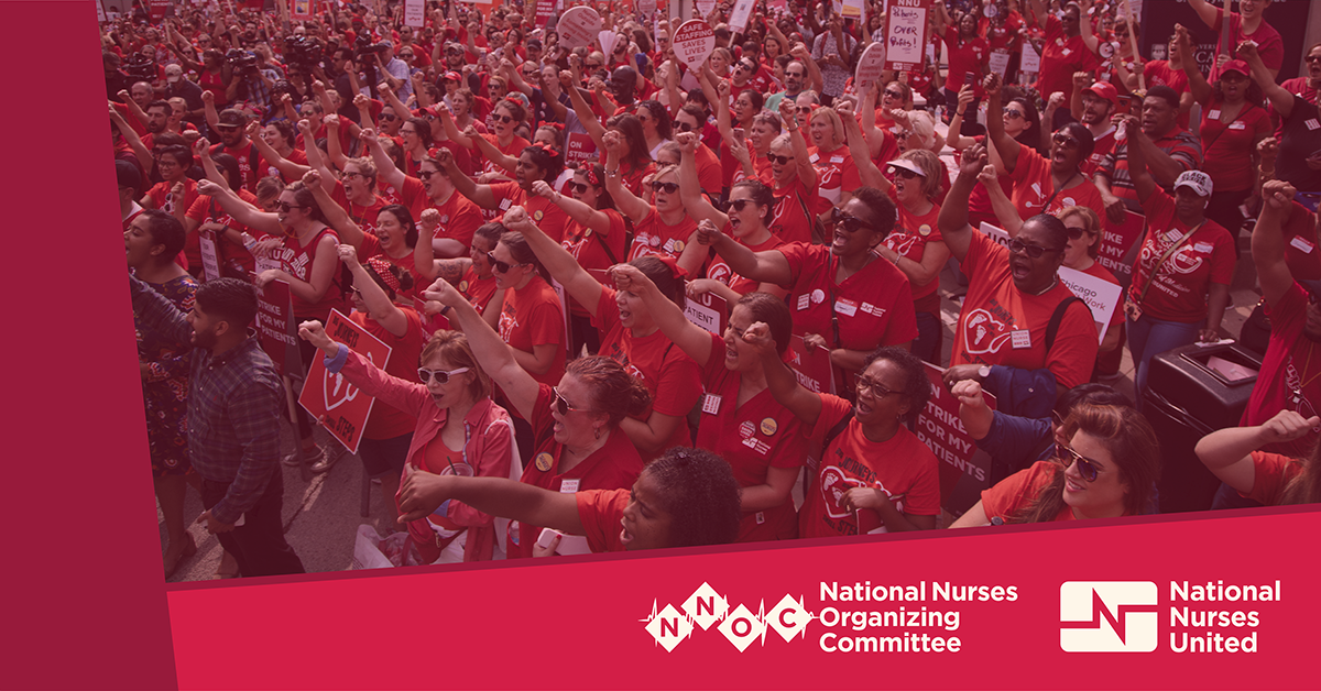 Huge crowd of nurses with raised fists above National Nurses Organizing Committee/National Nurses United logos