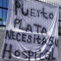 Sign "Puerto Plata Necesitas Su Hospital"