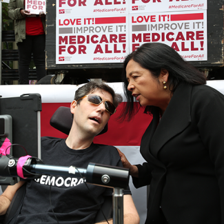 Ady barkan talking to NNU Executive Director Bonnie Castillo and Medicare for All event