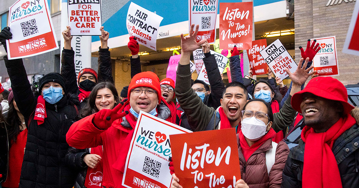 Group of nurses at rally holding signs