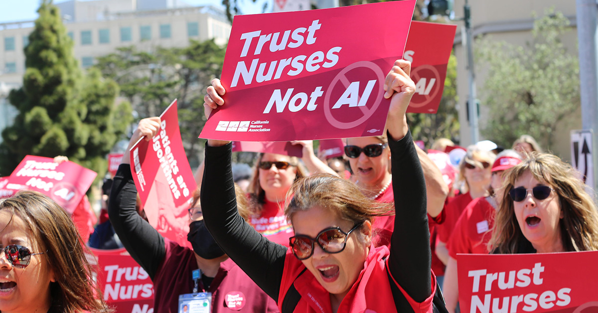 Nurses marching, holding signs "Trust Nurses Not A.I."