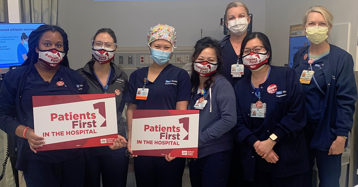 UCLA nurses hold signs that read "Patients first in the hospital."