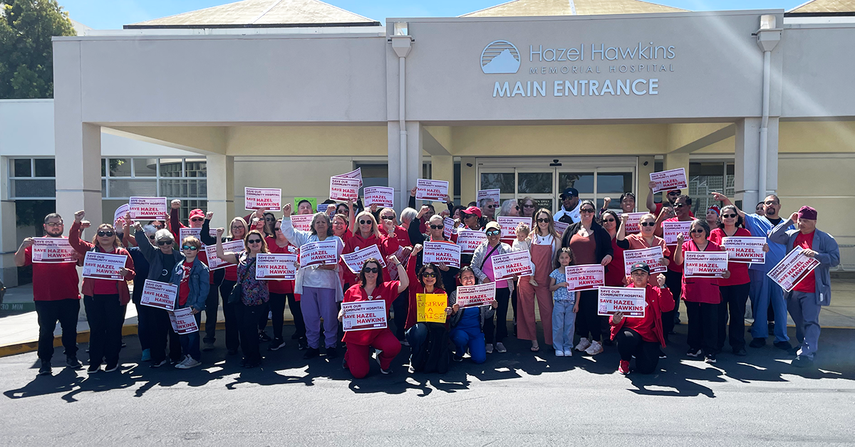 Hazel Hawkins RNs and community holding signs in front of hospital to "Save our community hospital. Save Hazel Hawkins."