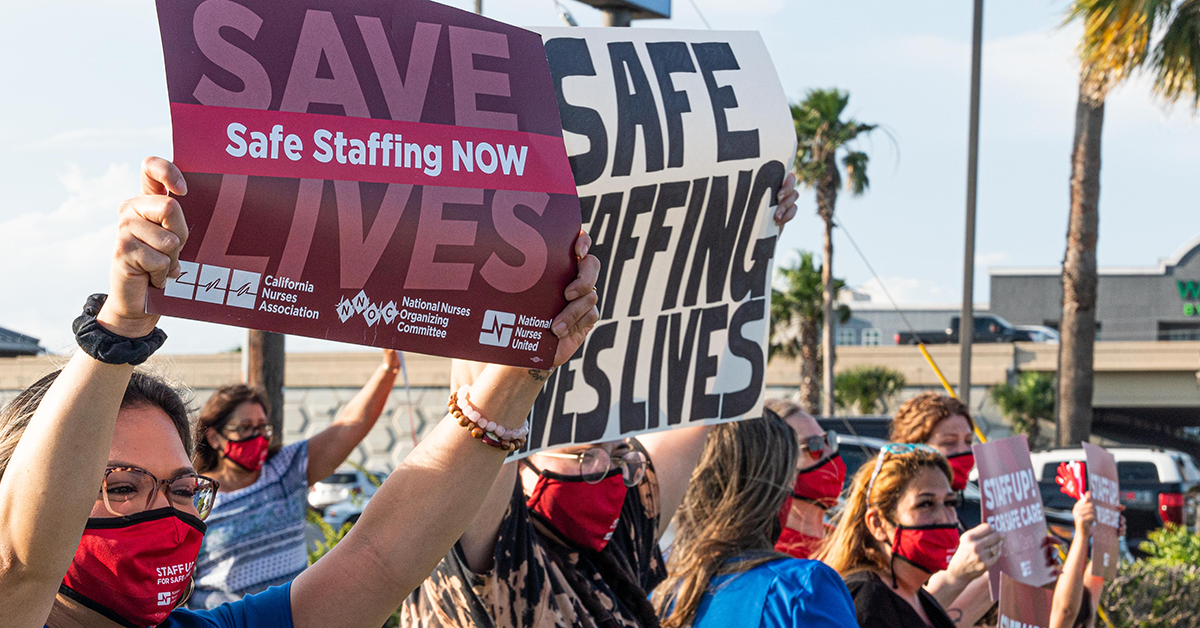 Corpus Christi nurses holding signs on street "Save lives: Safe staffing now" and "Safe staffing saves lives"