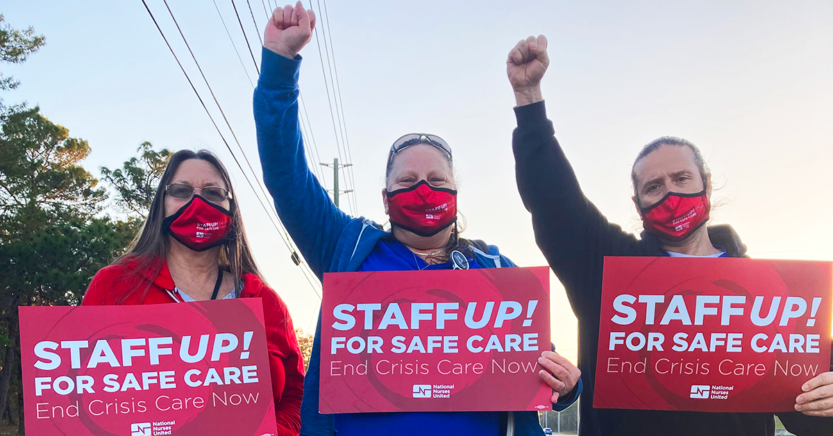 Three Oak Hill RNS holding signs "Staff up for safe care! End crisis care now."