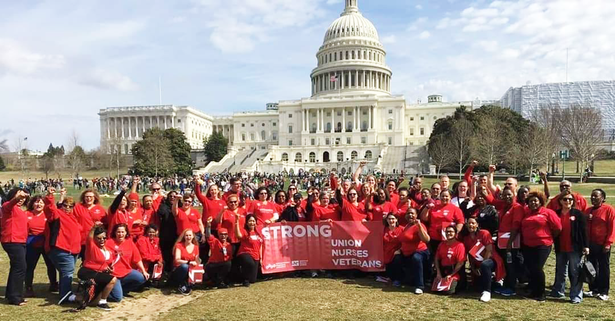 VA nurses in front of D.C. capitol with banner "Strong Nurses, Union, Veterans"