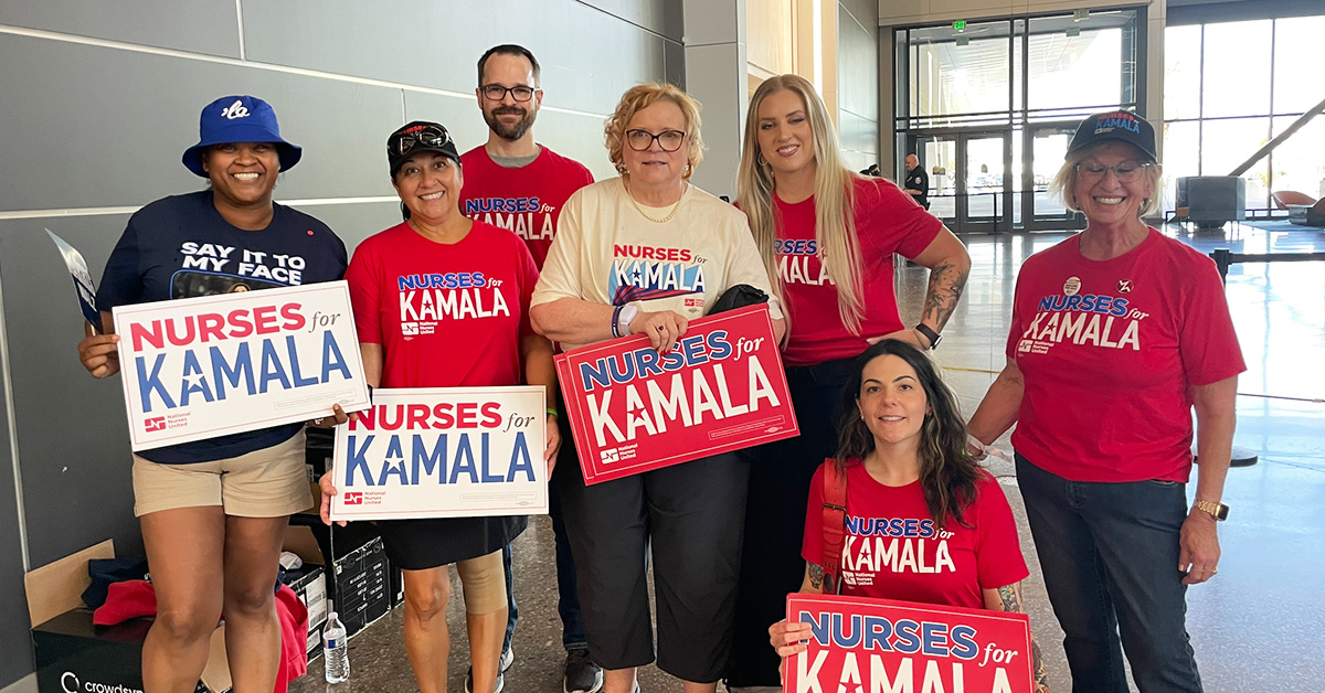 Group of canvassers holding signs "Nurses for Kamala"