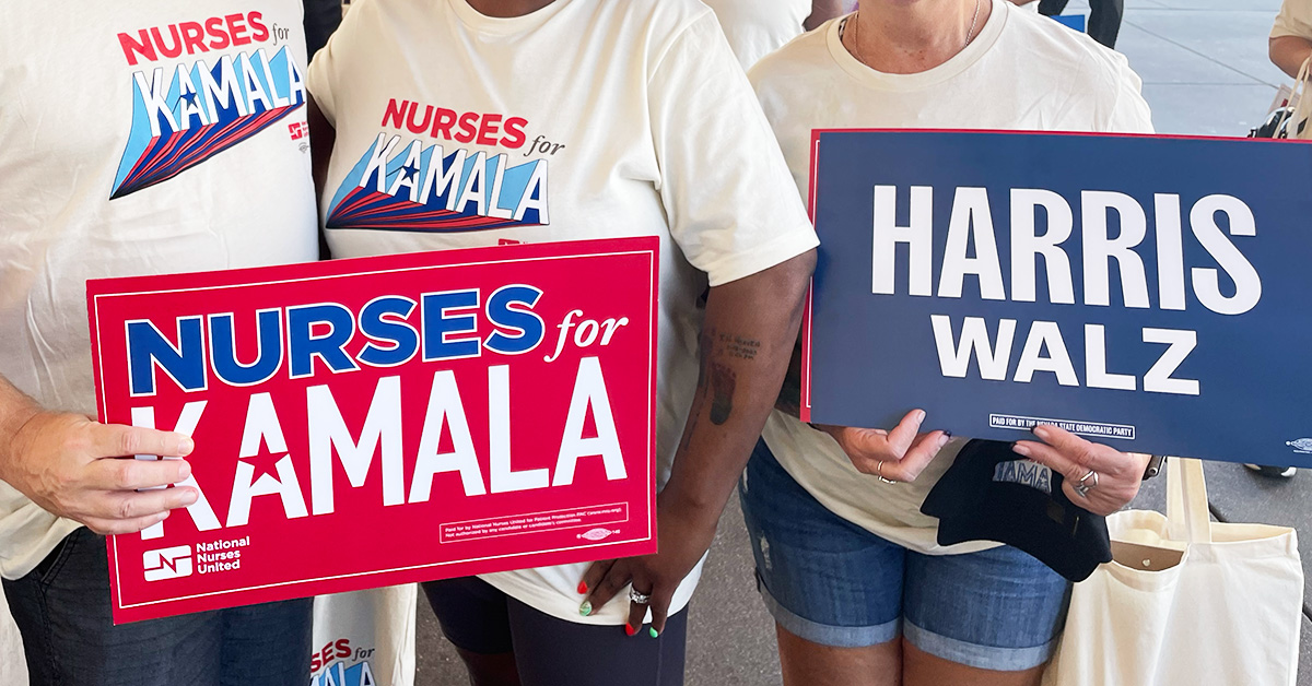 Nurses holding signs "Nurses for Kamala", "Harris, Walz"