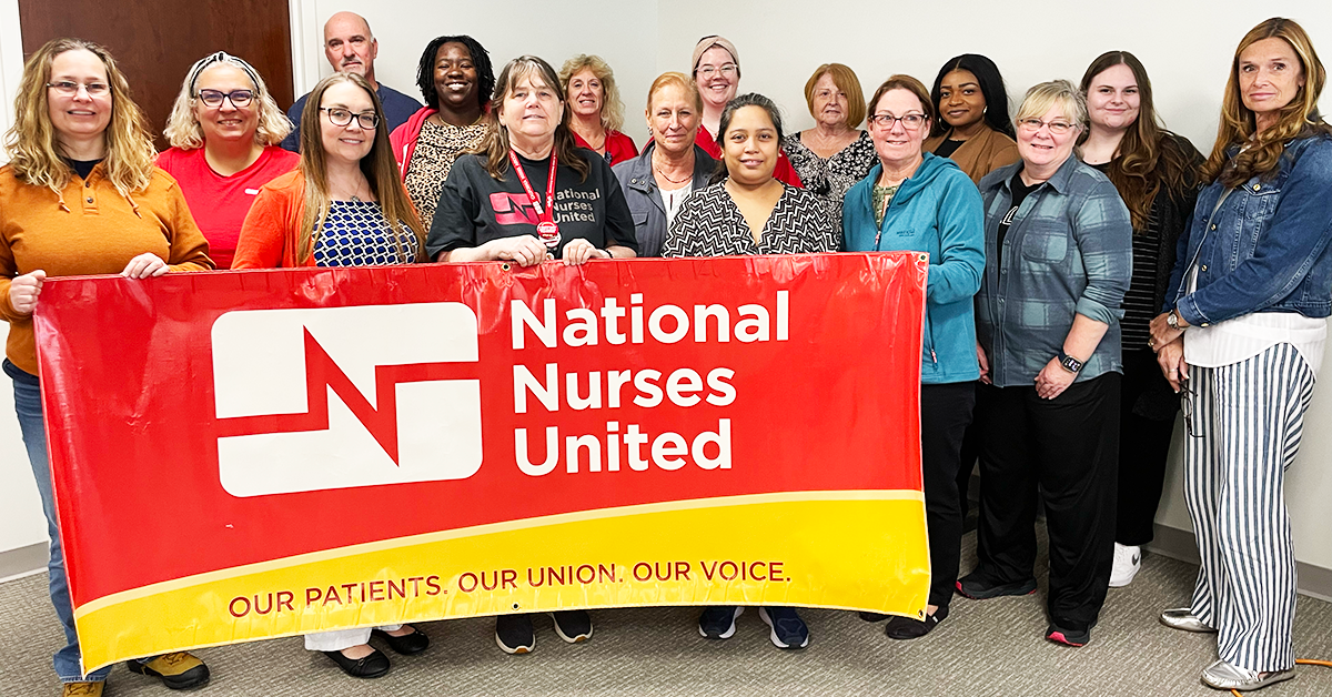 Tampa nurses holding banner "National Nurses United: Our Patients, Our Union, Our Voice"