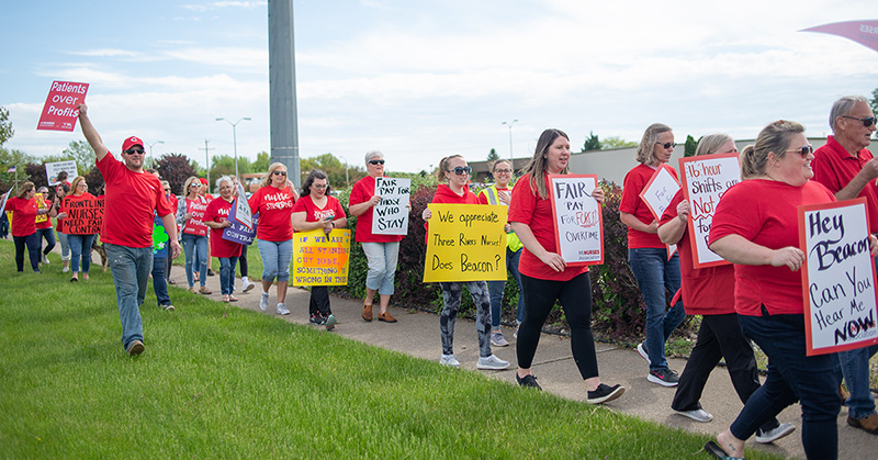 Long line of nurses outside protest for fair contracts