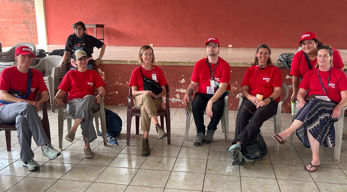 Group of RNRN volunteer nurses sitting at Guatemala clinic site