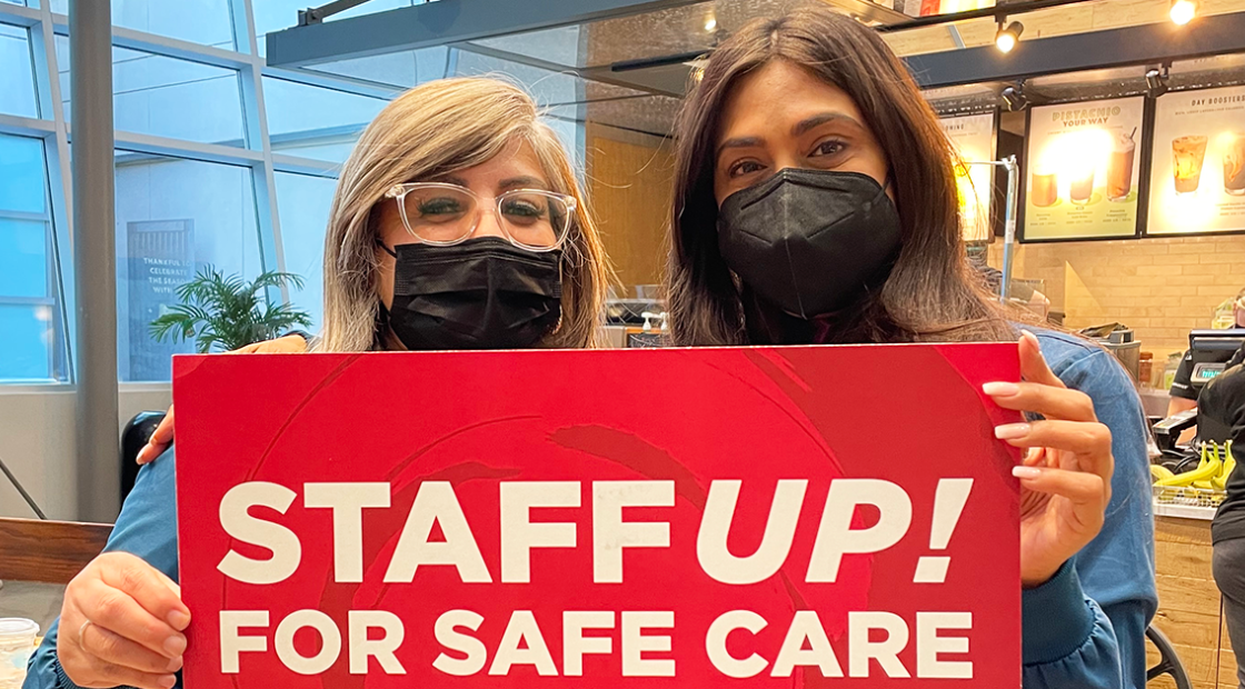 Nurses hold sign that reads "Staff up for safe care!"