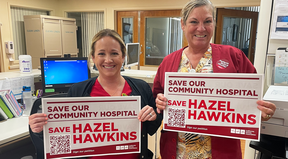Nurses holding signs, "Save our community hospital, save Hazel Hawkins"