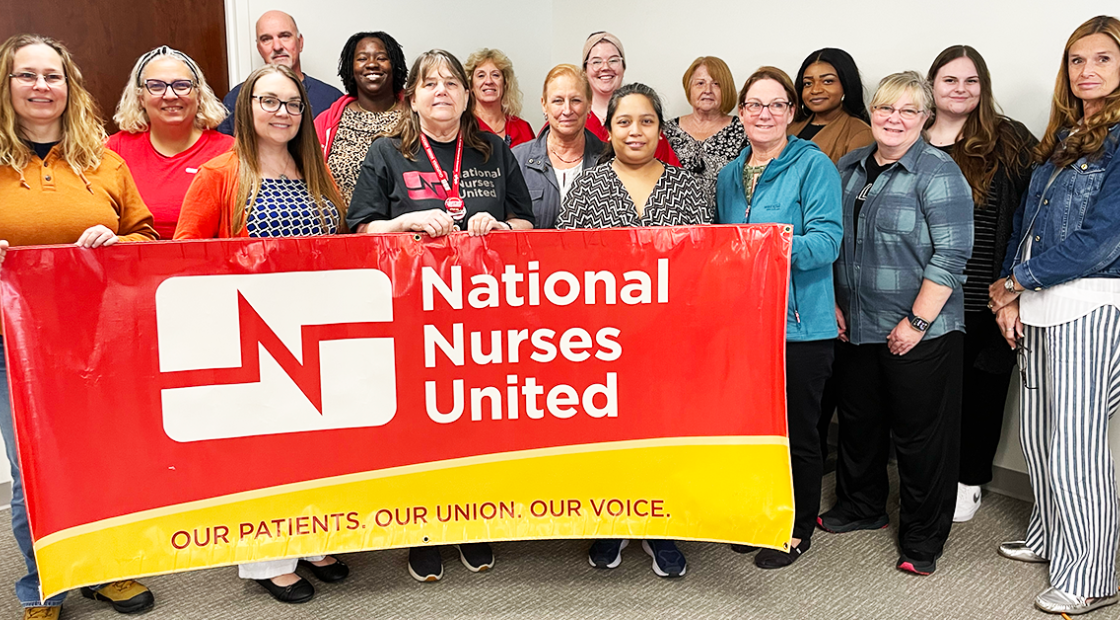 Tampa nurses holding banner "National Nurses United: Our Patients, Our Union, Our Voice"