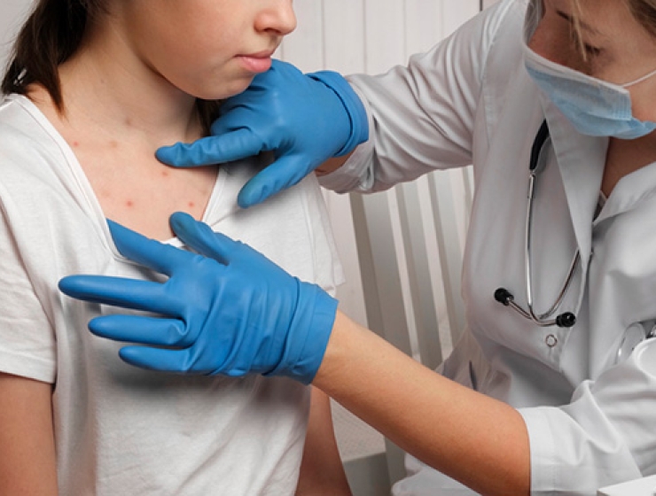 Nurse administering to patient
