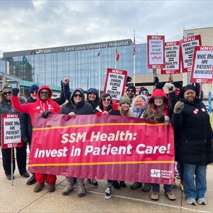 Large group of nurses holding banner "SSM Health: Invest in Patient Care!"