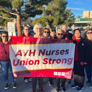 AVH nurses pose with banner that reads "AVH union strong."