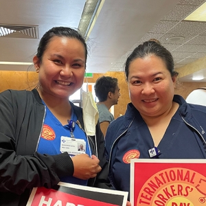 Two nurses smiling inside hospital