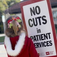 No cuts in patient services sign