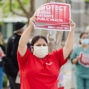 Nurses holds sign "Protect Nurses"
