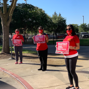 San Joaquin County nurses hold signs "Protect Nurses"